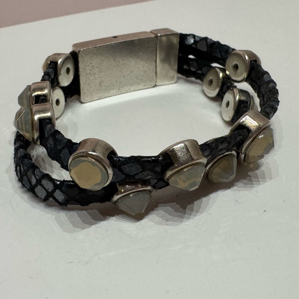 The Rock bracelet with tone-on-tone crystals on dark silver gunmetal leather.